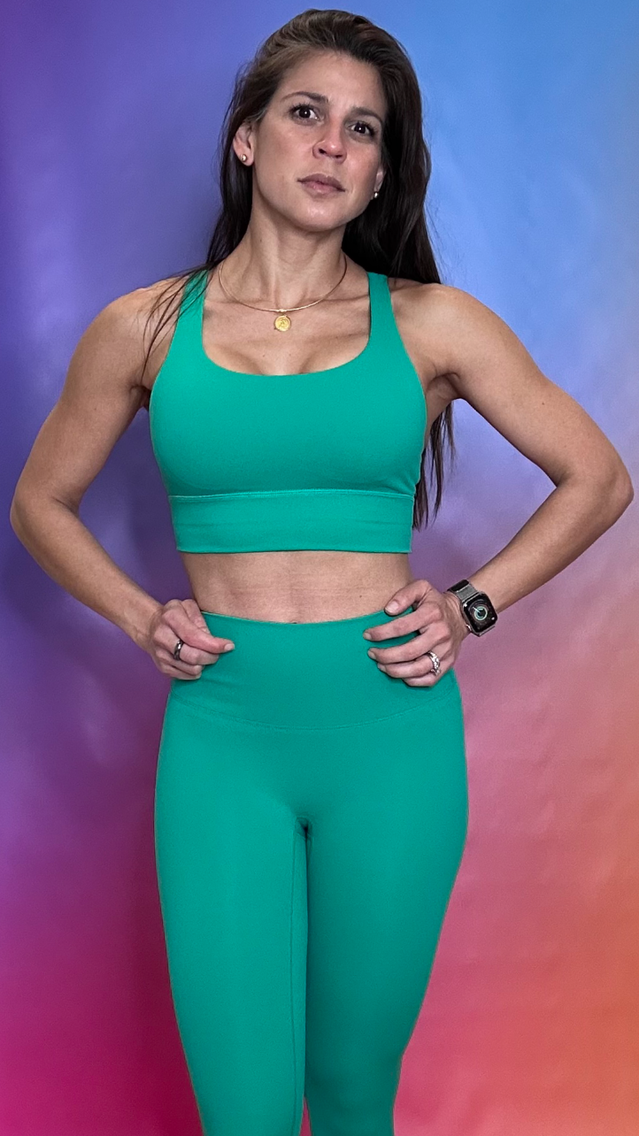 Front view of Hustle Bra in green — high-performance sports bra