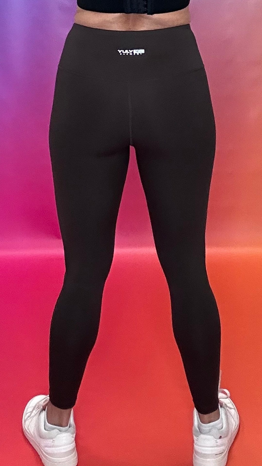 Back view of chocolate brown Emerge Legging showing flattering fit