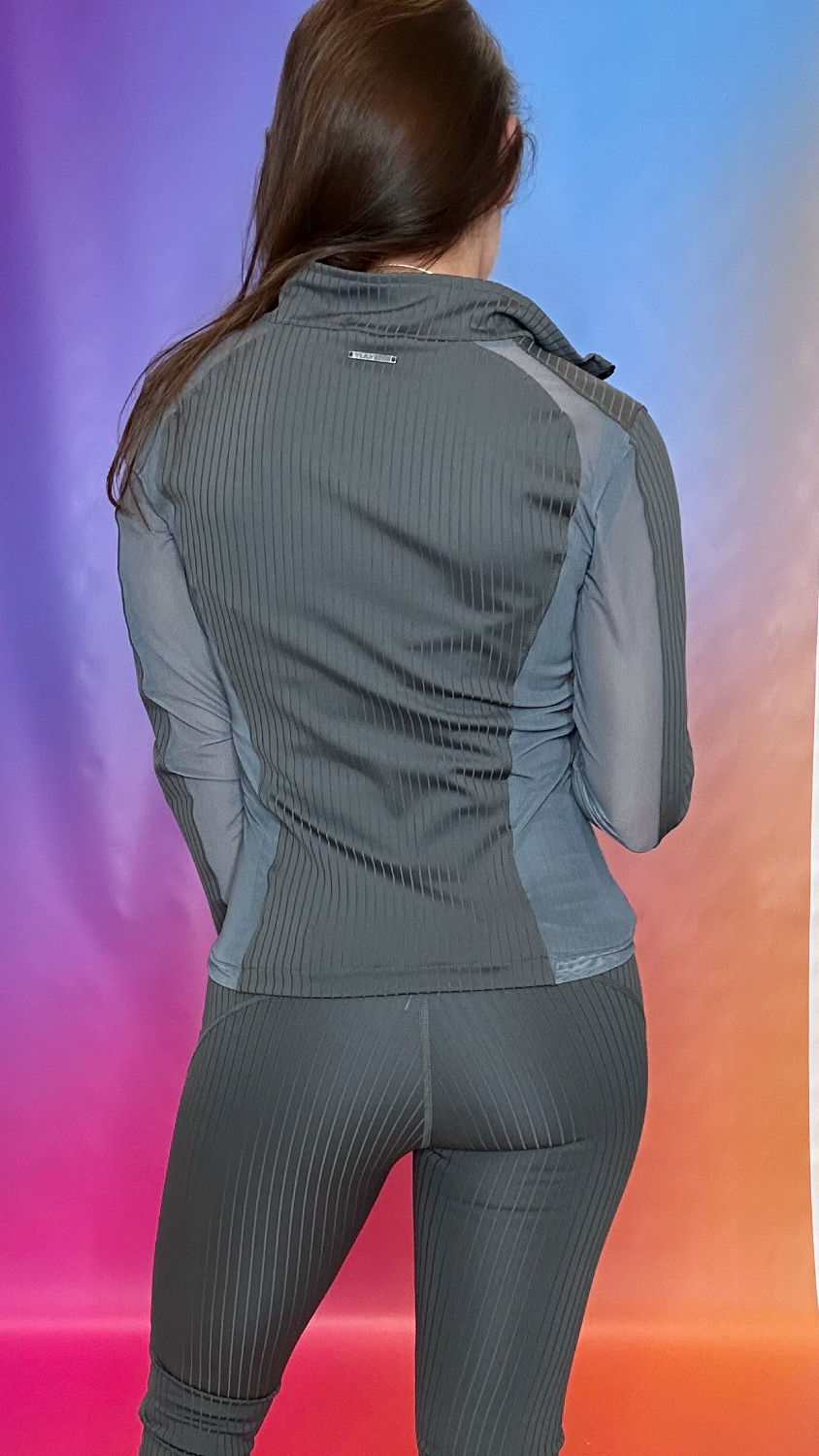 Back view of Enclave Jacket in gray — stylish breathable design with mesh panels