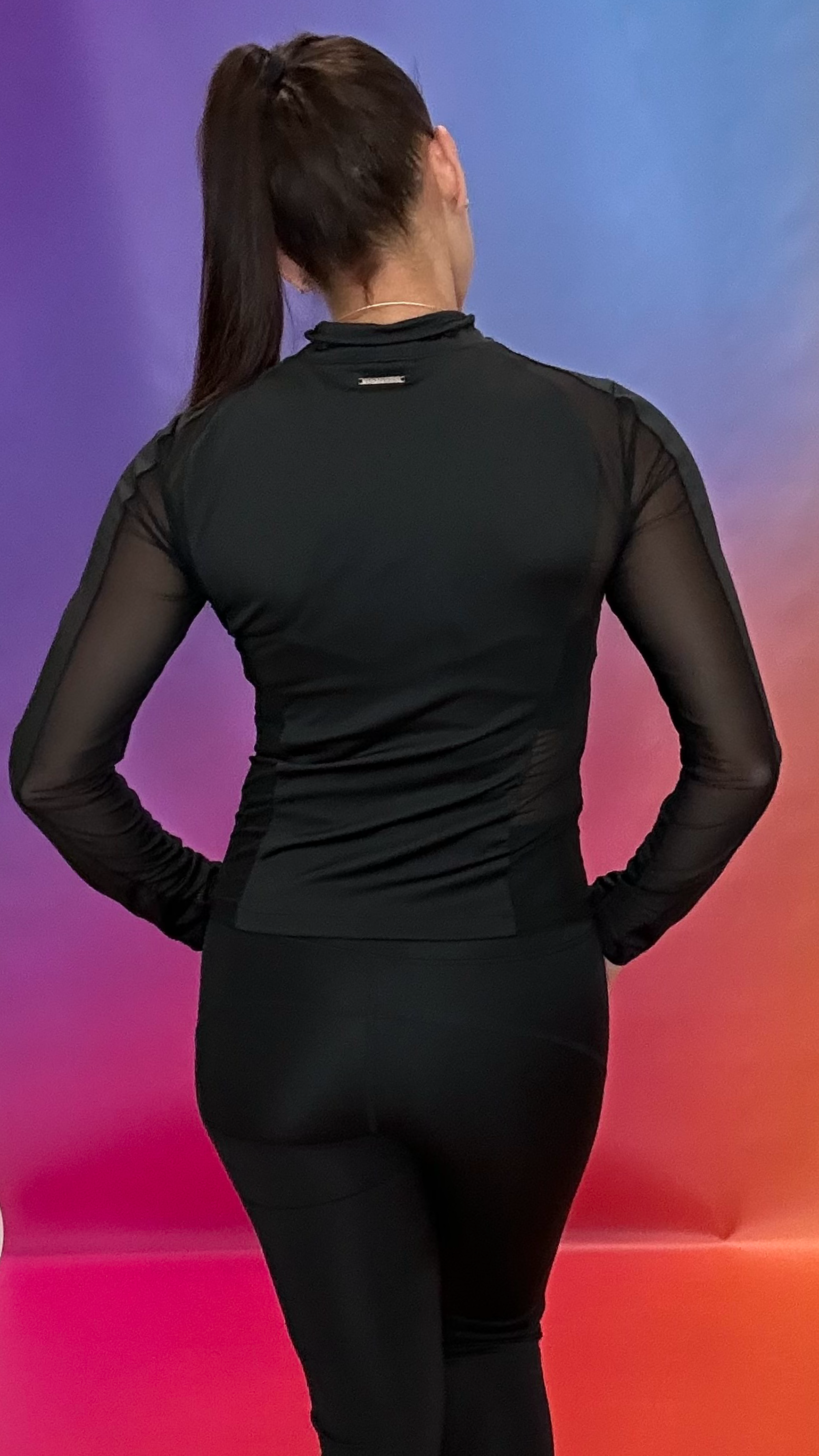 Back view of Go Getter Jacket — form-fitting performance jacket