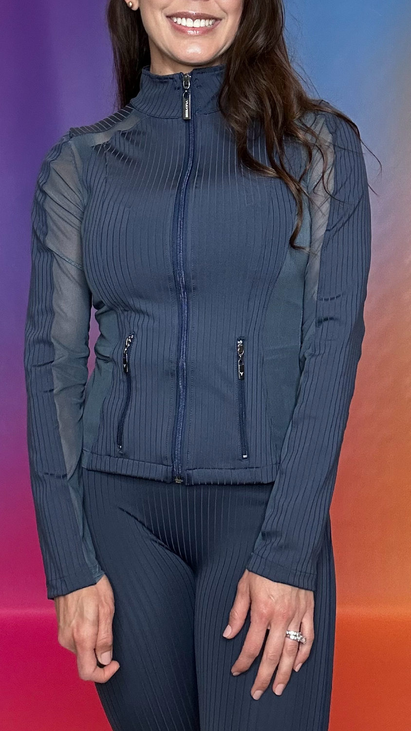 Close-up detail of Enclave Jacket in navy — high-quality ribbed stretch fabric for comfort and style
