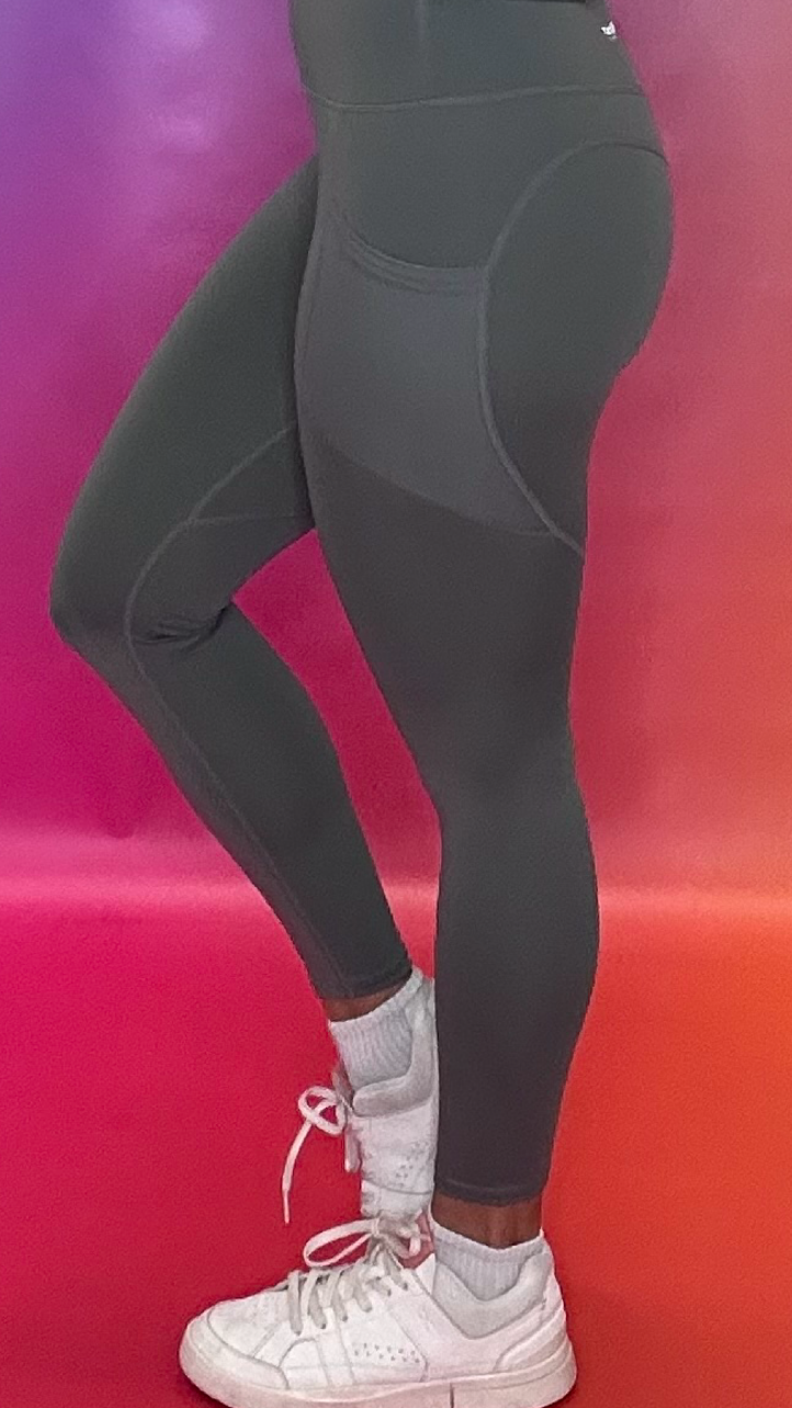 Side profile of Synergy Leggings in gray — supportive flexible workout leggings