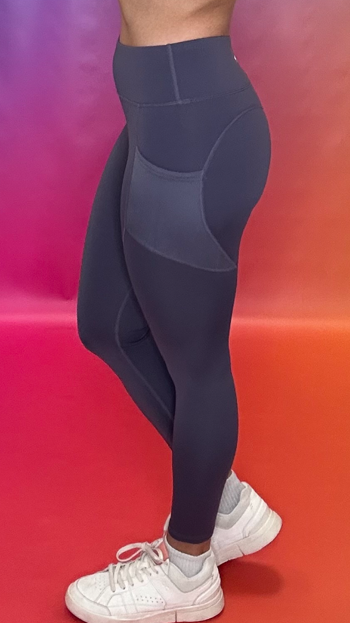 Side profile of Synergy Leggings in plum — body-hugging fit for training and casual wear