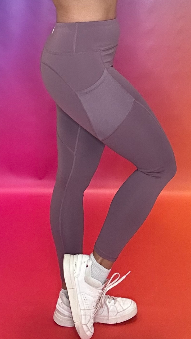 Side profile of Synergy Leggings in purple — affordable high-performance leggings